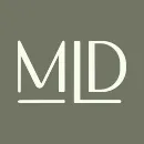 Monogram "md" presented in a sleek, modern font on a muted background, symbolizing the precision of last mile tracking software.